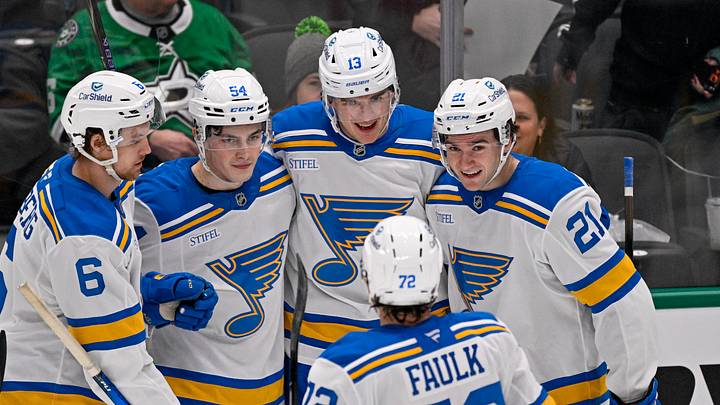 Feb 4, 2026; Dallas, Texas, USA; St. Louis Blues right wing Dalibor Dvorsky (54) and right wing Alexey Toropchenko (13) and defenseman Philip Broberg (6) and defenseman Justin Faulk (72) and right wing Jimmy Snuggerud (21) celebrates a goal scored by Toropchenko against the Dallas Stars during the third period at the American Airlines Center. Mandatory Credit: Jerome Miron-Imagn Images