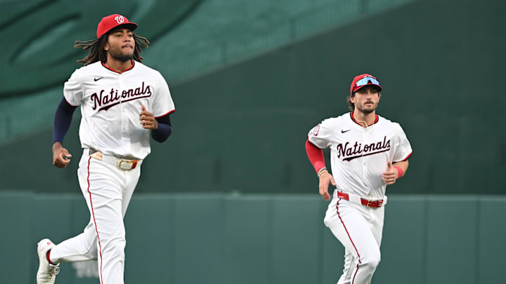 Aug 26, 2024; Washington, District of Columbia, USA; Washington Nationals left fielder James Wood (29) and center fielder Dylan Crews (3) warm up before a game against the New York Yankees at Nationals Park.