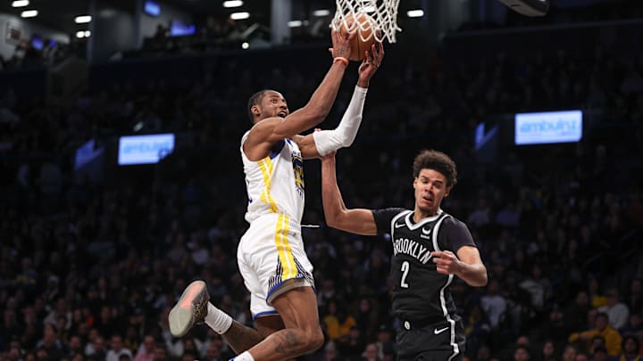 Feb 5, 2024; Brooklyn, New York, USA; Golden State Warriors guard Gary Payton II (0) drives for a shot against Brooklyn Nets forward Cameron Johnson (2) during the second half at Barclays Center. Mandatory Credit: Vincent Carchietta-Imagn Images Feb 5, 2024; Brooklyn, New York, USA; Golden State Warriors guard Gary Payton II (0) drives for a shot against Brooklyn Nets forward Cameron Johnson (2) during the second half at Barclays Center. Mandatory Credit: Vincent Carchietta-Imagn Images