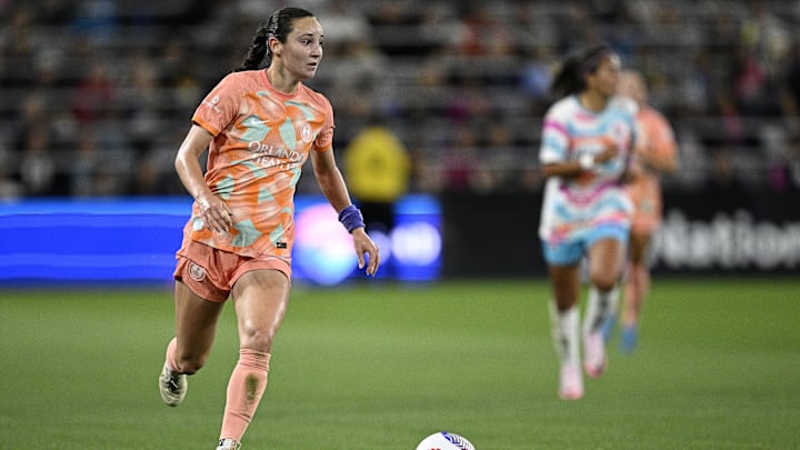 Jun 7, 2024; San Diego, California, USA; Orlando Pride defender Brianna Martinez (32) kicks the ball against San Diego Wave FC during the second half at Snapdragon Stadium. Mandatory Credit: Orlando Ramirez-USA TODAY Sports