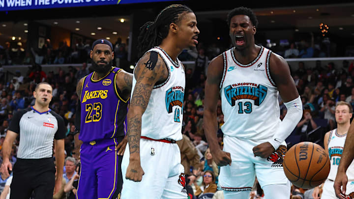 Mar 29, 2025; Memphis, Tennessee, USA; Memphis Grizzlies guard Ja Morant (12) and forward Jaren Jackson Jr. (13) react during the third quarter against the Los Angeles Lakers at FedExForum. Mandatory Credit: Petre Thomas-Imagn Images