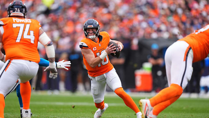 Oct 27, 2024; Denver, Colorado, USA; Denver Broncos quarterback Bo Nix (10) scrambles with the ball in the first half against the Carolina Panthers at Empower Field at Mile High. Oct 27, 2024; Denver, Colorado, USA; Denver Broncos quarterback Bo Nix (10) scrambles with the ball in the first half against the Carolina Panthers at Empower Field at Mile High.