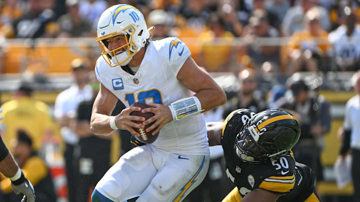 Sep 22, 2024; Pittsburgh, Pennsylvania, USA; Pittsburgh Steelers linebacker Elandon Roberts (50) sacks Los Angeles Chargers quarterback Justin Herbert (10) during the third quarter at Acrisure Stadium.
