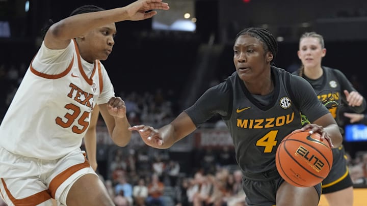 Jan 30, 2025; Austin, Texas, USA; Missouri Tigers forward Laniah Randle (4) drives to the basket against Texas Longhorns forward Madison Booker (35) during the second half at Moody Center. Mandatory Credit: Scott Wachter-Imagn Images Jan 30, 2025; Austin, Texas, USA; Missouri Tigers forward Laniah Randle (4) drives to the basket against Texas Longhorns forward Madison Booker (35) during the second half at Moody Center. Mandatory Credit: Scott Wachter-Imagn Images