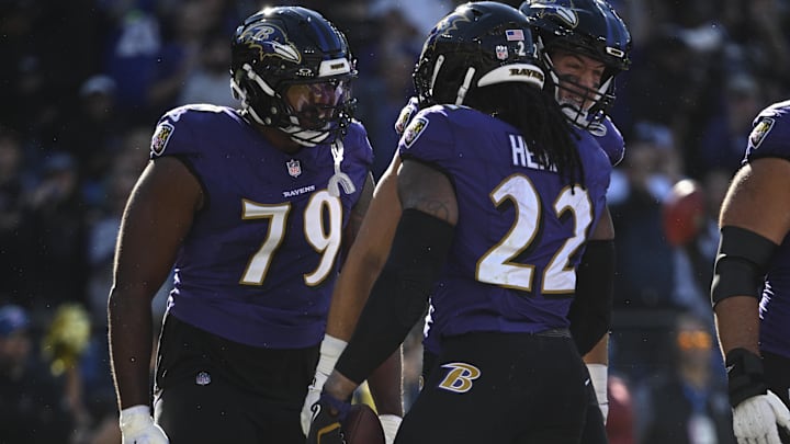 Baltimore Ravens running back Derrick Henry celebrates with offensive tackle Ronnie Stanley