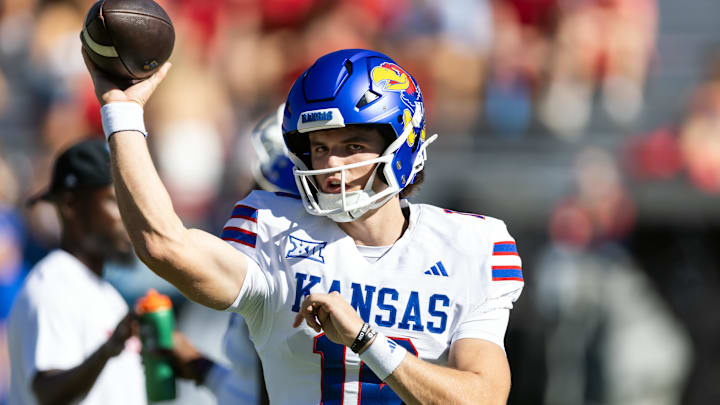 Nov 8, 2025; Tucson, Arizona, USA; Kansas Jayhawks quarterback David McComb (16) against the Arizona Wildcats at Arizona Stadium. Mandatory Credit: Mark J. Rebilas-Imagn Images