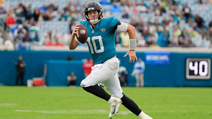 Jacksonville Jaguars quarterback Mac Jones (10) rushes for yards during the fourth quarter Sunday, Dec. 29, 2024 at EverBank Stadium in Jacksonville, Fla. The Jaguars held off the Titans 20-13. [Corey Perrine/Florida Times-Union]