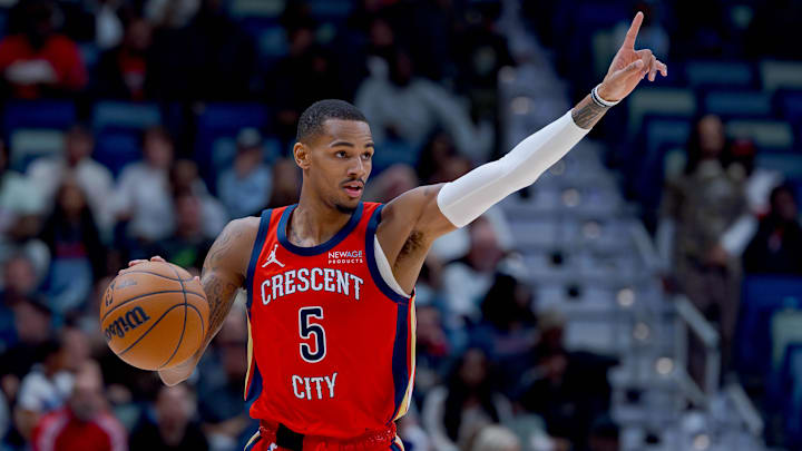 Dec 27, 2024; New Orleans, Louisiana, USA; New Orleans Pelicans guard Dejounte Murray (5) signals as he dribbles against the Memphis Grizzlies during the first quarter at Smoothie King Center. Mandatory Credit: Matthew Hinton-Imagn Images