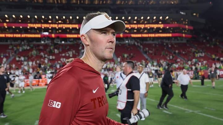 Sep 26, 2026; Los Angeles, California, USA;  USC Trojans head coach Lincoln Riley walks off the field after the game against the Oregon Ducks at United Airlines Field at Los Angeles Memorial Coliseum.  Mandatory Credit: Kiyoshi Mio-Imagn Images