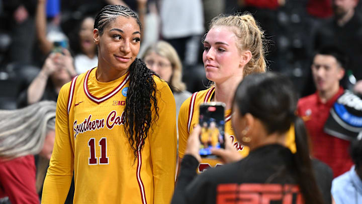 Mar 29, 2025; Spokane, WA, USA; USC Trojans guard Kennedy Smith (11) and USC Trojans guard Avery Howell (23) walk off the court during the second half of a Sweet 16 NCAA Tournament basketball game against the Kansas State Wildcats at Spokane Arena. Mandatory Credit: James Snook-Imagn Images