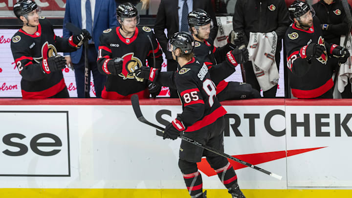 Feb 1, 2025; Ottawa, Ontario, CAN; Ottawa Senators defenseman Jake Sanderson (85) celebrates with teammates after scoring a goal in the third period against the Minnesota Wild at the Canadian Tire Centre. Mandatory Credit: Marc DesRosiers-Imagn Images Feb 1, 2025; Ottawa, Ontario, CAN; Ottawa Senators defenseman Jake Sanderson (85) celebrates with teammates after scoring a goal in the third period against the Minnesota Wild at the Canadian Tire Centre. Mandatory Credit: Marc DesRosiers-Imagn Images