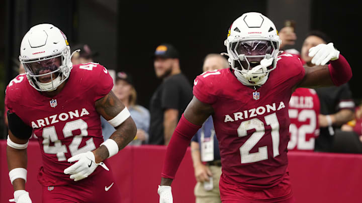 Cardinals cornerback Garrett Williams (21) celebrates an interception against the Commanders during a game at State Farm Stadium in Glendale on Sept. 29, 2024.