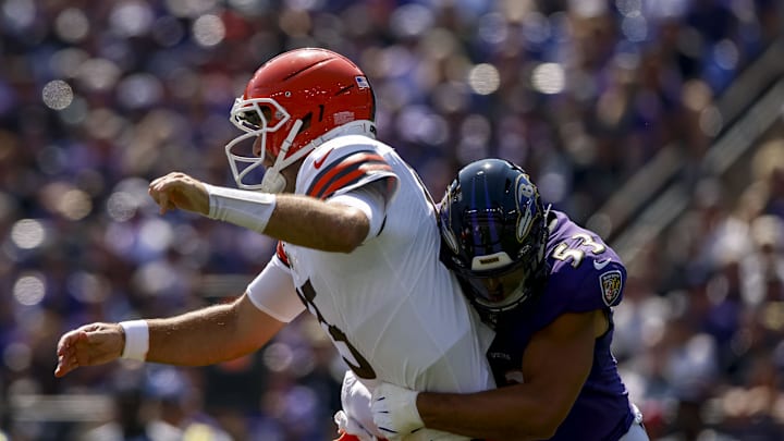 Sep 14, 2025; Baltimore, Maryland, USA;  Cleveland Browns quarterback Joe Flacco (15) is hit by Baltimore Ravens linebacker Kyle Van Noy (53) during the first quarter at M&T Bank Stadium. Mandatory Credit: Peter Casey-Imagn Images