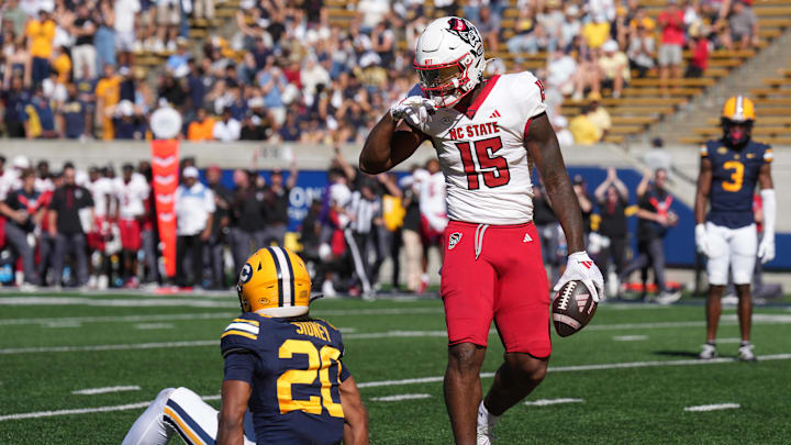 Oct 19, 2024; Berkeley, California, USA; North Carolina State Wolfpack tight end Justin Joly (15) gestures after catching a pass against California Golden Bears defensive back Cam Sidney (20) during the second quarter at California Memorial Stadium. Mandatory Credit: Darren Yamashita-Imagn Images