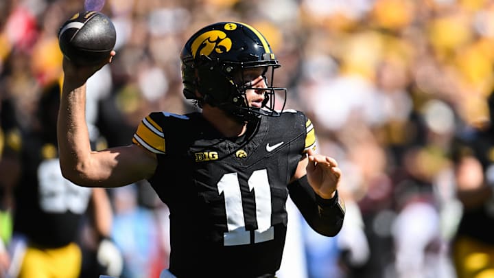 Sep 27, 2025; Iowa City, Iowa, USA; Iowa Hawkeyes quarterback Mark Gronowski (11) throws a pass against the Indiana Hoosiers during the first quarter at Kinnick Stadium. Mandatory Credit: Jeffrey Becker-Imagn Images