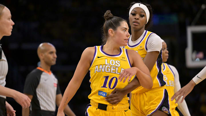 Los Angeles Sparks forward Rickea Jackson holds back guard Kelsey Plum after tempers flared in the second half against the Chicago Sky.