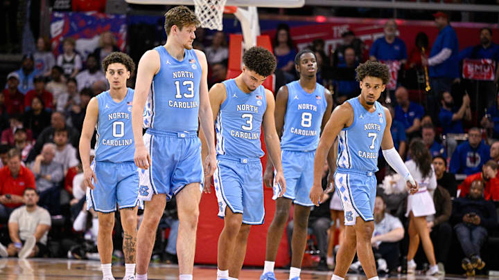 Jan 3, 2026; Dallas, Texas, USA; North Carolina Tar Heels guard Kyan Evans (0) and center Henri Veesaar (13) and guard Derek Dixon (3) and forward Caleb Wilson (8) and guard Seth Trimble (7) come back on the court during the second half against the SMU Mustangs at Moody Coliseum. Mandatory Credit: Jerome Miron-Imagn Images