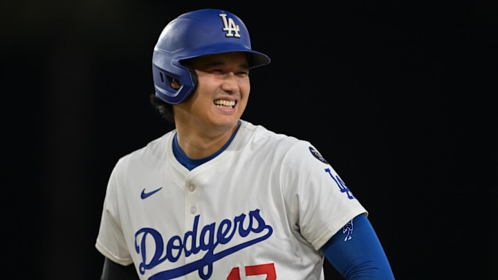 Sep 10, 2025; Los Angeles, California, USA; Los Angeles Dodgers designated hitter Shohei Ohtani (17) smiles after he was awarded first base on catcher interference during the eighth inning against the Colorado Rockies at Dodger Stadium. Mandatory Credit: Jayne Kamin-Oncea-Imagn Images Sep 10, 2025; Los Angeles, California, USA; Los Angeles Dodgers designated hitter Shohei Ohtani (17) smiles after he was awarded first base on catcher interference during the eighth inning against the Colorado Rockies at Dodger Stadium. Mandatory Credit: Jayne Kamin-Oncea-Imagn Images