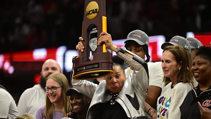 Dawn Staley and her South Carolina Gamecocks basketball coaching staff after winning the national title on Sunday