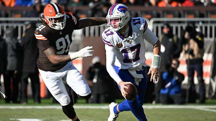 Buffalo Bills quarterback Josh Allen (17) is pressured by Cleveland Browns defensive end Alex Wright (91) during the first half at Huntington Bank Field.
