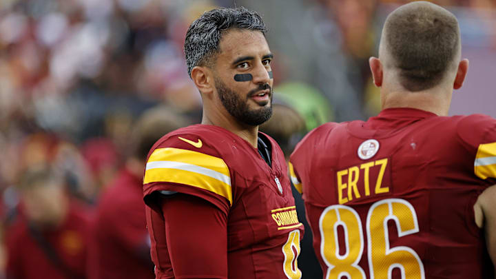 Sep 21, 2025; Landover, Maryland, USA; Washington Commanders quarterback Marcus Mariota (8) and Washington Commanders tight end Zach Ertz (86) react from the sidelines during the second half Las Vegas Raiders at Northwest Stadium. Mandatory Credit: Geoff Burke-Imagn Images