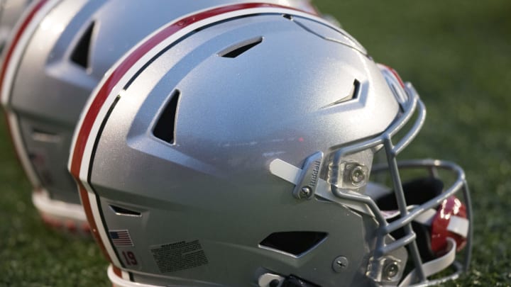 Oct 28, 2023; Madison, Wisconsin, USA;  Ohio State Buckeyes helmets sit on the field during warmups prior to the game against the Wisconsin Badgers at Camp Randall Stadium. Mandatory Credit: Jeff Hanisch-USA TODAY Sports