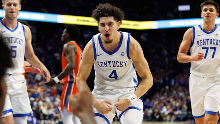 Nov 9, 2024; Lexington, Kentucky, USA; Kentucky Wildcats guard Koby Brea (4) celebrates as he runs to help center Amari Williams up from the floor during the second half against the Bucknell Bison at Rupp Arena at Central Bank Center. Mandatory Credit: Jordan Prather-Imagn Images