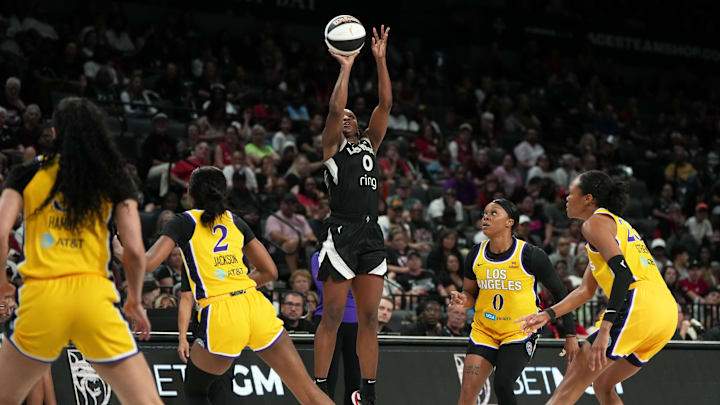 Jun 11, 2025; Las Vegas, Nevada, USA; Las Vegas Aces guard Jackie Young (0) shoots the ball against the Los Angeles Sparks during the first half of a WNBA basketball game at Michelob Ultra Arena. 
