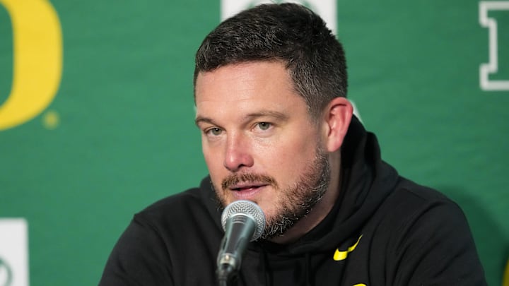 Nov 16, 2024; Madison, Wisconsin, USA;  Oregon Ducks head coach Dan Lanning talks to the media during the post game press conference following the game against the Wisconsin Badgers at Camp Randall Stadium. Mandatory Credit: Jeff Hanisch-Imagn Images