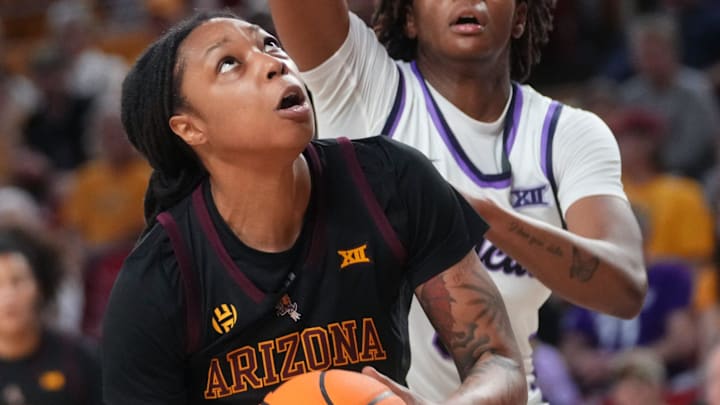 ASU Sun Devils guard Gabby Elliott (0) looks to shoot the ball as Kansas State Wildcats guard Brandie Harrod (3) defends at Desert Financial Arena in Tempe on Feb. 1, 2026. ASU Sun Devils guard Gabby Elliott (0) looks to shoot the ball as Kansas State Wildcats guard Brandie Harrod (3) defends at Desert Financial Arena in Tempe on Feb. 1, 2026.