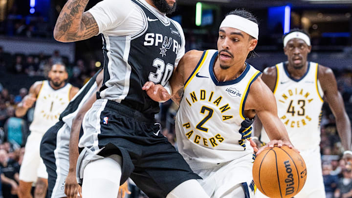Oct 13, 2025; Indianapolis, Indiana, USA;Indiana Pacers guard/forward Andrew Nembhard (2) dribbles the ball while San Antonio Spurs forward Julian Champagnie (30) defends in the first half at Gainbridge Fieldhouse. Mandatory Credit: Trevor Ruszkowski-Imagn Images Oct 13, 2025; Indianapolis, Indiana, USA;Indiana Pacers guard/forward Andrew Nembhard (2) dribbles the ball while San Antonio Spurs forward Julian Champagnie (30) defends in the first half at Gainbridge Fieldhouse. Mandatory Credit: Trevor Ruszkowski-Imagn Images