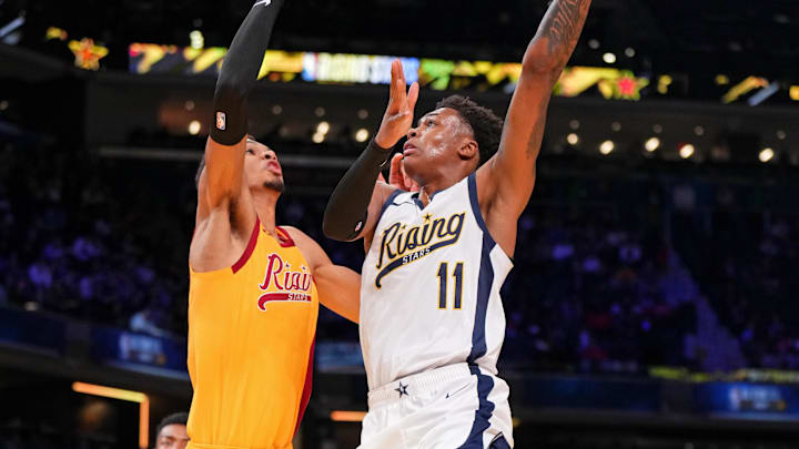 Feb 16, 2024; Indianapolis, Indiana, USA; Team Detlef forward Tyler Smith (11) of the G League Ignite shoots the ball against Team Pau center Victor Wembanyama (1) of the San Antonio Spurs during a Rising Stars semifinal game at Gainbridge Fieldhouse. Mandatory Credit: Kyle Terada-USA TODAY Sports Feb 16, 2024; Indianapolis, Indiana, USA; Team Detlef forward Tyler Smith (11) of the G League Ignite shoots the ball against Team Pau center Victor Wembanyama (1) of the San Antonio Spurs during a Rising Stars semifinal game at Gainbridge Fieldhouse. Mandatory Credit: Kyle Terada-USA TODAY Sports
