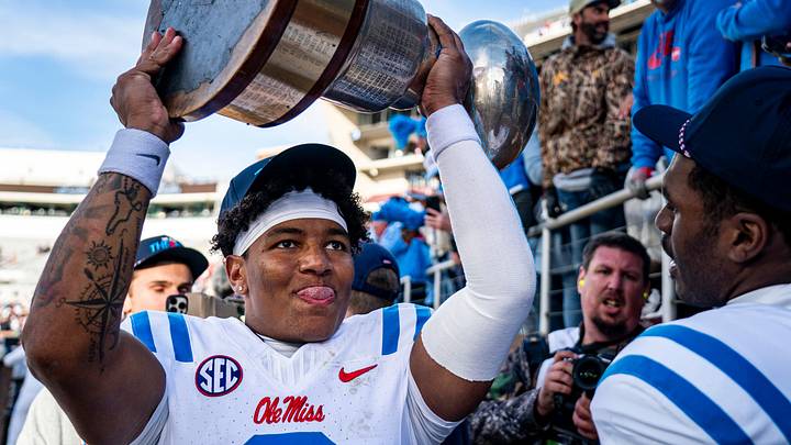 Ole Miss quarterback Trinidad Chambliss raises the Golden Egg trophy after a college football game between Mississippi State and Ole Miss Ole Miss quarterback Trinidad Chambliss raises the Golden Egg trophy after a college football game between Mississippi State and Ole Miss
