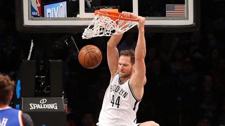 Feb 1, 2017; Brooklyn, NY, USA; Brooklyn Nets shooting guard Bojan Bogdanovic (44) dunks over New York Knicks point guard Brandon Jennings (3) during the first quarter at Barclays Center. Mandatory Credit: Brad Penner-Imagn Images
