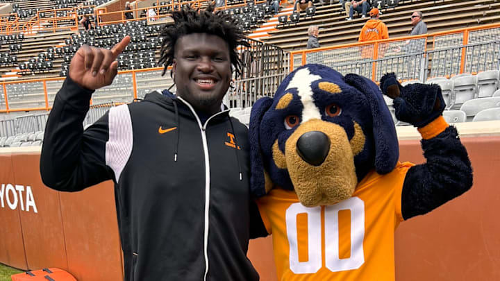 Tennessee Volunteers mascot Smokey with 2026 G'nivre Carr on his visit