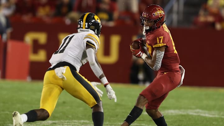 Sep 14, 2019; Ames, IA, USA; Iowa Hawkeyes defensive back Michael Ojemudia (11) looks to tackle Iowa State Cyclones wide receiver Darren Wilson (17) at Jack Trice Stadium. Iowa beat Iowa State 18-17.  Mandatory Credit: Reese Strickland-Imagn Images