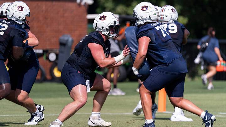 Auburn Tigers offensive lineman Cole Best (72) runs drills during the first day of football practice at the Woltosz Football Performance Center in Auburn, Ala. on Wednesday, Aug. 5, 2026. Auburn Tigers offensive lineman Cole Best (72) runs drills during the first day of football practice at the Woltosz Football Performance Center in Auburn, Ala. on Wednesday, Aug. 5, 2026.
