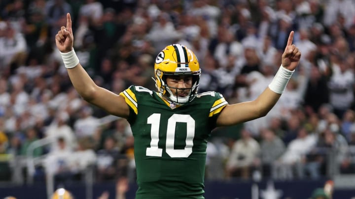 Green Bay Packers QB Jordan Love reacts after a touchdown at the Dallas Cowboys in the 2023 NFL playoffs.