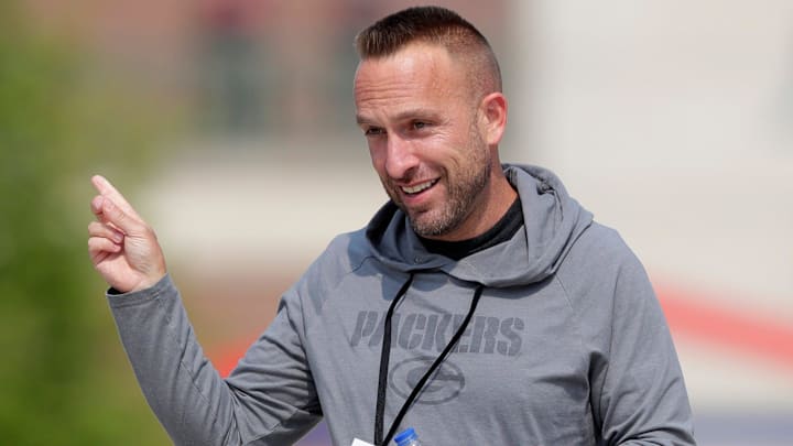 Green Bay Packers defensive coordinator Jeff Hafley interacts with fans before the start of practice on July 25, 2025, in Green Bay, Wis.
