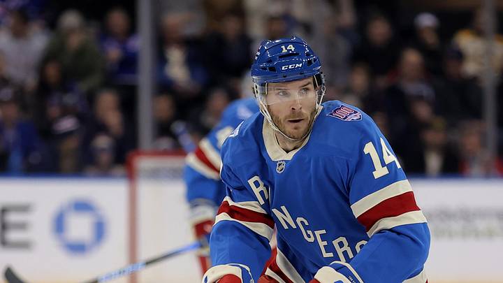 Jan 26, 2026; New York, New York, USA; New York Rangers right wing Taylor Raddysh (14) controls the puck against the Boston Bruins during the second period at Madison Square Garden. Mandatory Credit: Brad Penner-Imagn Images