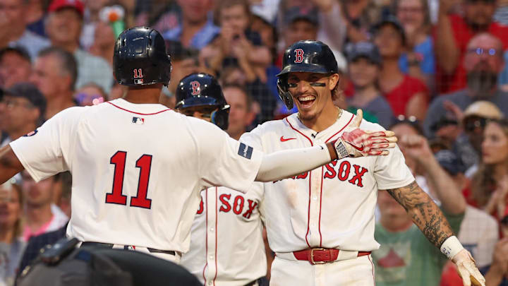 Jun 24, 2024; Boston, Massachusetts, USA; Boston Red Sox third baseman Rafael Devers (11) and Boston Red Sox left fielder Jarren Duran (16) celebrate after a two run home run by Devers during the fourth inning against the Toronto Blue Jays at Fenway Park. Mandatory Credit: Paul Rutherford-Imagn Images