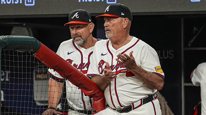 Jul 1, 2025; Cumberland, Georgia, USA; Atlanta Braves manager Brian Snitker (43) shown reacting in the dugout during the game against the Los Angeles Angels during the seventh inning at Truist Park. Mandatory Credit: Dale Zanine-Imagn Images