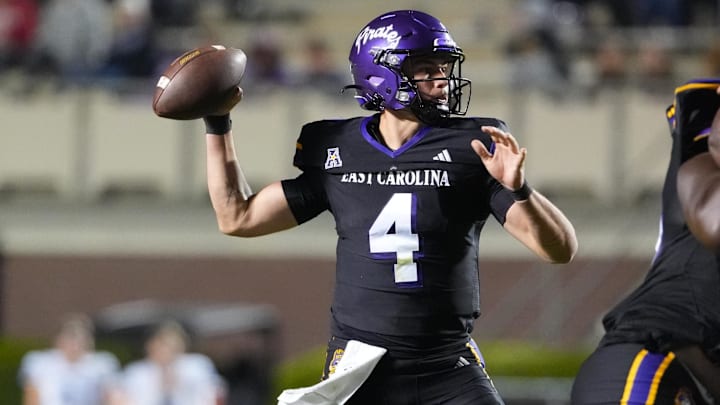 Oct 16, 2025; Greenville, North Carolina, USA;  East Carolina Pirates quarterback Katin Houser (4) throws the ball against the Tulsa Golden Hurricane during the second half at Dowdy-Ficklen Stadium. Mandatory Credit: James Guillory-Imagn Images