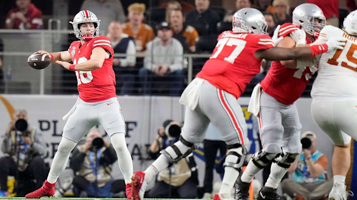 Ohio State Buckeyes quarterback Will Howard (18) drops back to pass against Texas Longhorns defense in the first quarter of the Cotton Bowl Classic during the College Football Playoff semifinal game at AT&T Stadium in Arlington, Texas on January, 10, 2025. Ohio State Buckeyes quarterback Will Howard (18) drops back to pass against Texas Longhorns defense in the first quarter of the Cotton Bowl Classic during the College Football Playoff semifinal game at AT&T Stadium in Arlington, Texas on January, 10, 2025.
