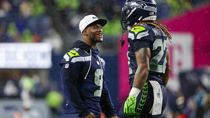Aug 15, 2025; Seattle, Washington, USA; Seattle Seahawks running back Damien Martinez (22) celebrates with running back Kenneth Walker III (9) after rushing for a touchdown against the Kansas City Chiefs during the third quarter at Lumen Field. 