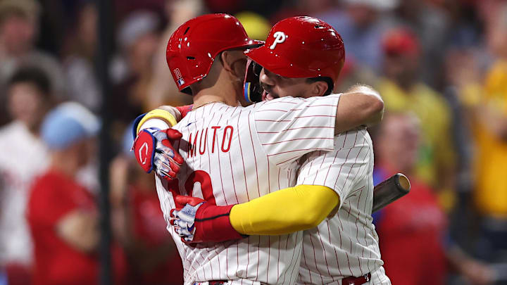 Philadelphia Phillies outfielder Kyle Schwarber (12) hugs catcher J.T. Realmuto (10) after hitting a home run during the fifth inning at Citizens Bank Park. Philadelphia Phillies outfielder Kyle Schwarber (12) hugs catcher J.T. Realmuto (10) after hitting a home run during the fifth inning at Citizens Bank Park.