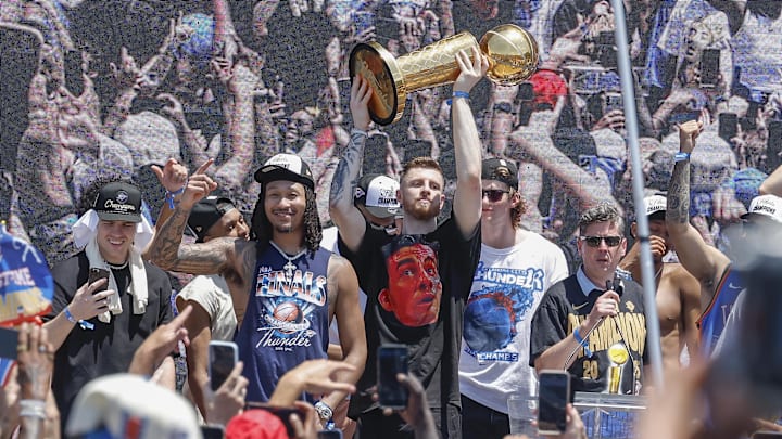 Jun 24, 2025; Oklahoma City, OK, USA; Oklahoma City Thunder center Isaiah Hartenstein holds the Larry O'Brien Championship Trophy during the Oklahoma City Thunder Champions parade. Mandatory Credit: Alonzo Adams-Imagn Images