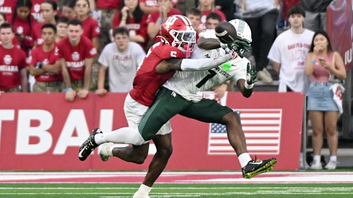 Oct 18, 2025; Bloomington, Indiana, USA; Indiana Hoosiers defensive back D'Angelo Ponds (5) breaks up a pass intended for Michigan State Spartans wide receiver Omari Kelly (1) during the second half at Memorial Stadium. Mandatory Credit: Robert Goddin-Imagn Images