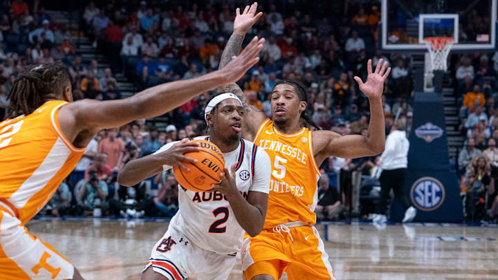 Auburn guard Denver Jones (2) drives the paint ahead of Tennessee guard Zakai Zeigler (5) during the first half of their semifinal game of the SEC Men's Basketball Tournament at Bridgestone Arena in Nashville, Tenn., Saturday, March 15, 2025.