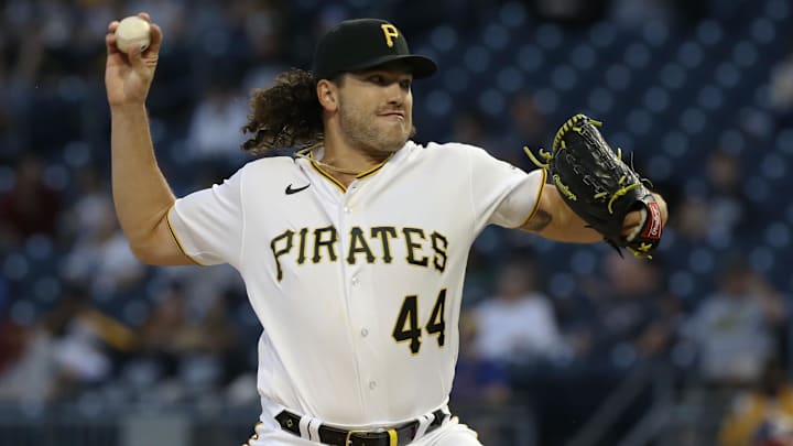 Pittsburgh Pirates relief pitcher Cody Ponce pitches in a white and black uniform and black hat Pittsburgh Pirates relief pitcher Cody Ponce pitches in a white and black uniform and black hat